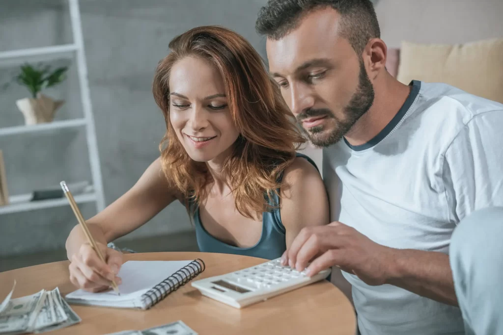 A couple planning a budget for a new home construction