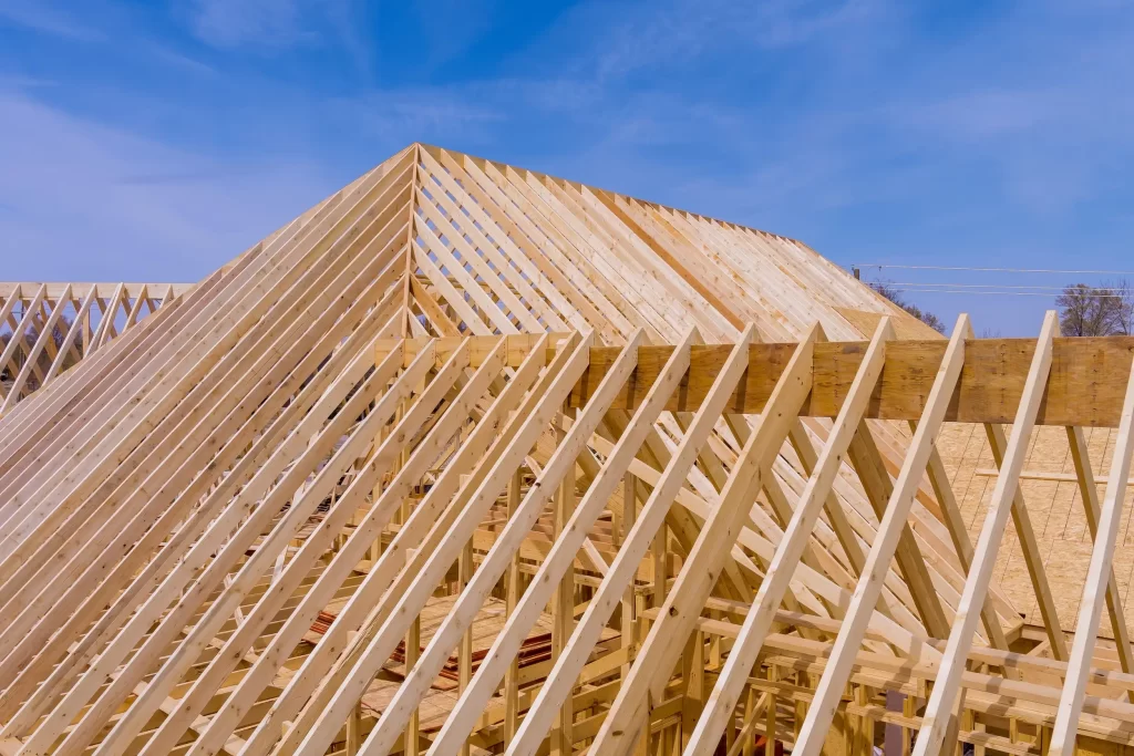 Engineered wood trusses installed in a modern home construction.