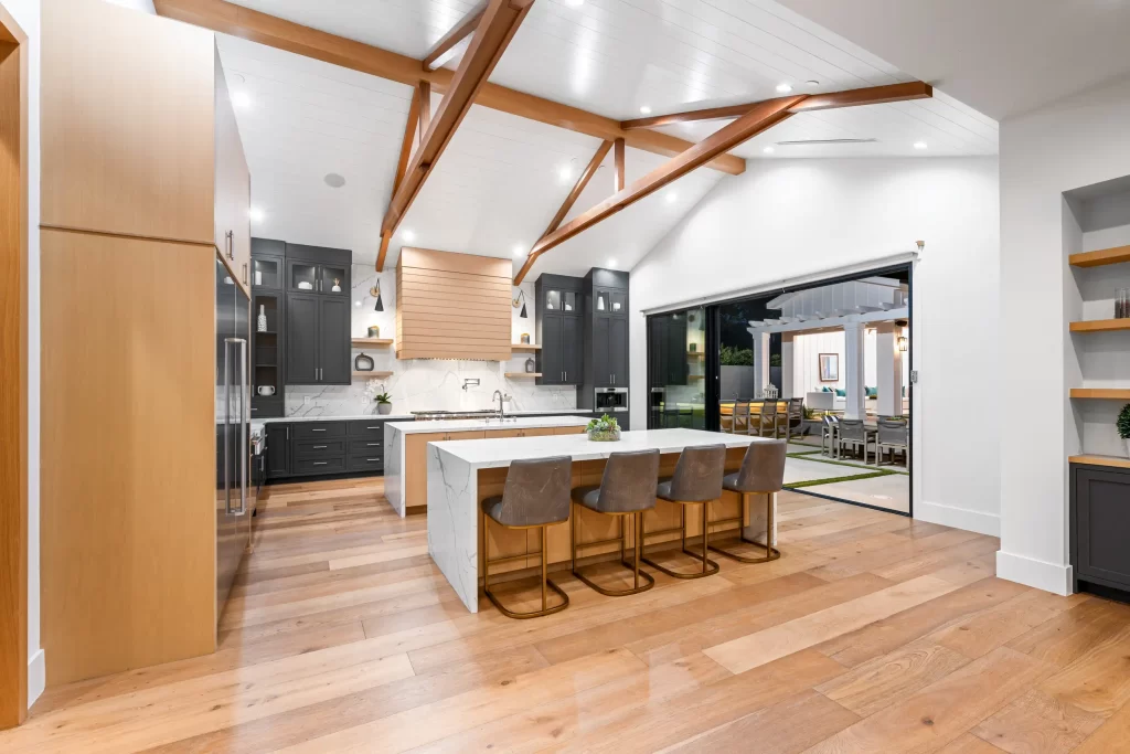 An open-concept home interior featuring engineered wood trusses.