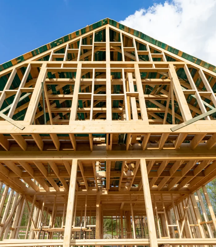 A new wooden framed house that is under construction.