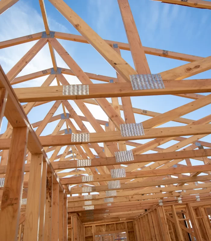 An image of the trusses of roof that is under construction